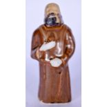 AN UNUSUAL POTTERY FIGURAL BOTTLE IN THE FORM OF A MONK, modelled standing in brown robes. 12.5 cm