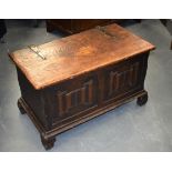 A 19TH CENTURY IRON BOUND OAK COFFER, with unusual motifs to front. 80 cm x 42 cm x 47 cm.