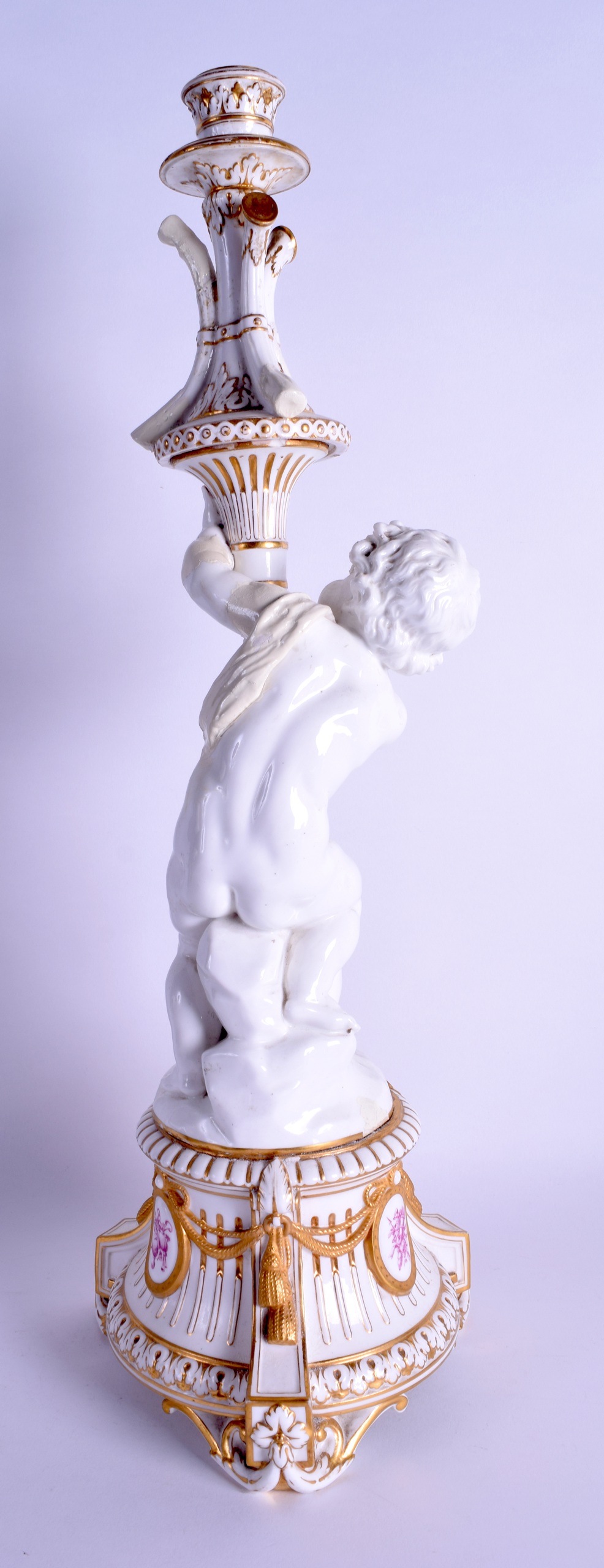 A LARGE 19TH CENTURY WHITE GLAZED PORCELAIN CANDLESTICK painted with puce arms, over scrolling - Image 2 of 2