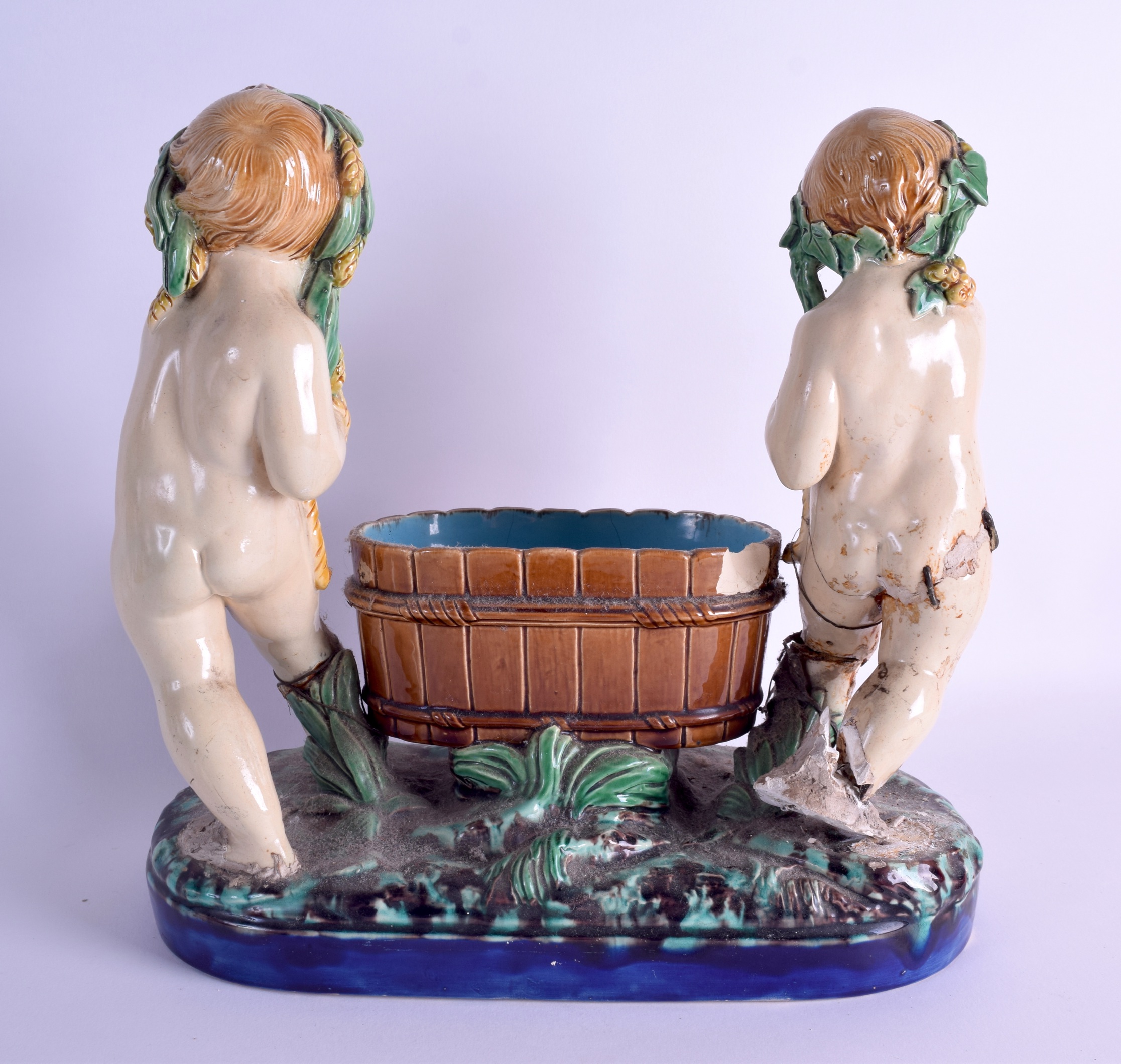 A 19TH CENTURY MINTON MAJOLICA FIGURAL GROUP depicting two putti covered in corn sheaths. 30 cm x 30 - Image 2 of 3