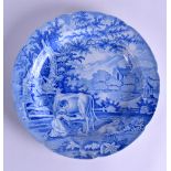 A RARE EARLY 19TH CENTURY STAFFORDSHIRE BLUE AND WHITE PLATE decorated with a figure milking a cow