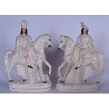 A LARGE PAIR OF 19TH CENTURY STAFFORDSHIRE POTTERY FIGURES, formed as males on horseback. 38 cm