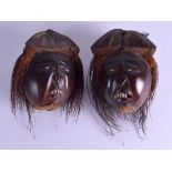 A PAIR OF 19TH CENTURY CONTINENTAL CARVED COCONUT HEADS. 10 cm x 13 cm.