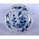 AN 18TH CENTURY TIN GLAZED BLUE AND WHITE DISH, decorated with flowers. 23.5 cm wide.