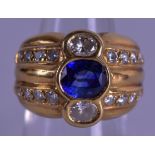 A 1970S GOLD DIAMOND AND SAPPHIRE RING the diamonds approx. 1.25 cts, the sapphire 1 ct. Size N.