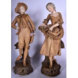 A LARGE PAIR OF AUSTRIAN PORCELAIN FIGURES, formed as a standing male and female on naturalistic