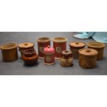 A SET OF THREE VICTORIAN PINK GROUND CHEMICAL STORAGE JARS, together with a group of stoneware pots,