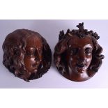 A LOVELY PAIR OF ENGLISH ARTS AND CRAFTS CARVED OAK WALL PLAQUES in the form of female mask heads.