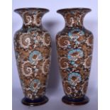 A LARGE PAIR OF DOULTON LAMBETH POTTERY VASES, decorated with extensive foliage. 40.5 cm high.