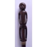 AN EARLY 20TH CENTURY AFRICAN CARVED HARDWOOD TRIBAL STAFF with figural terminal. 88 cm long.