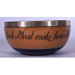 A SILVER MOUNTED DOULTON LAMBETH POTTERY BOWL, bearing inscription to side. 11.5 cm wide.