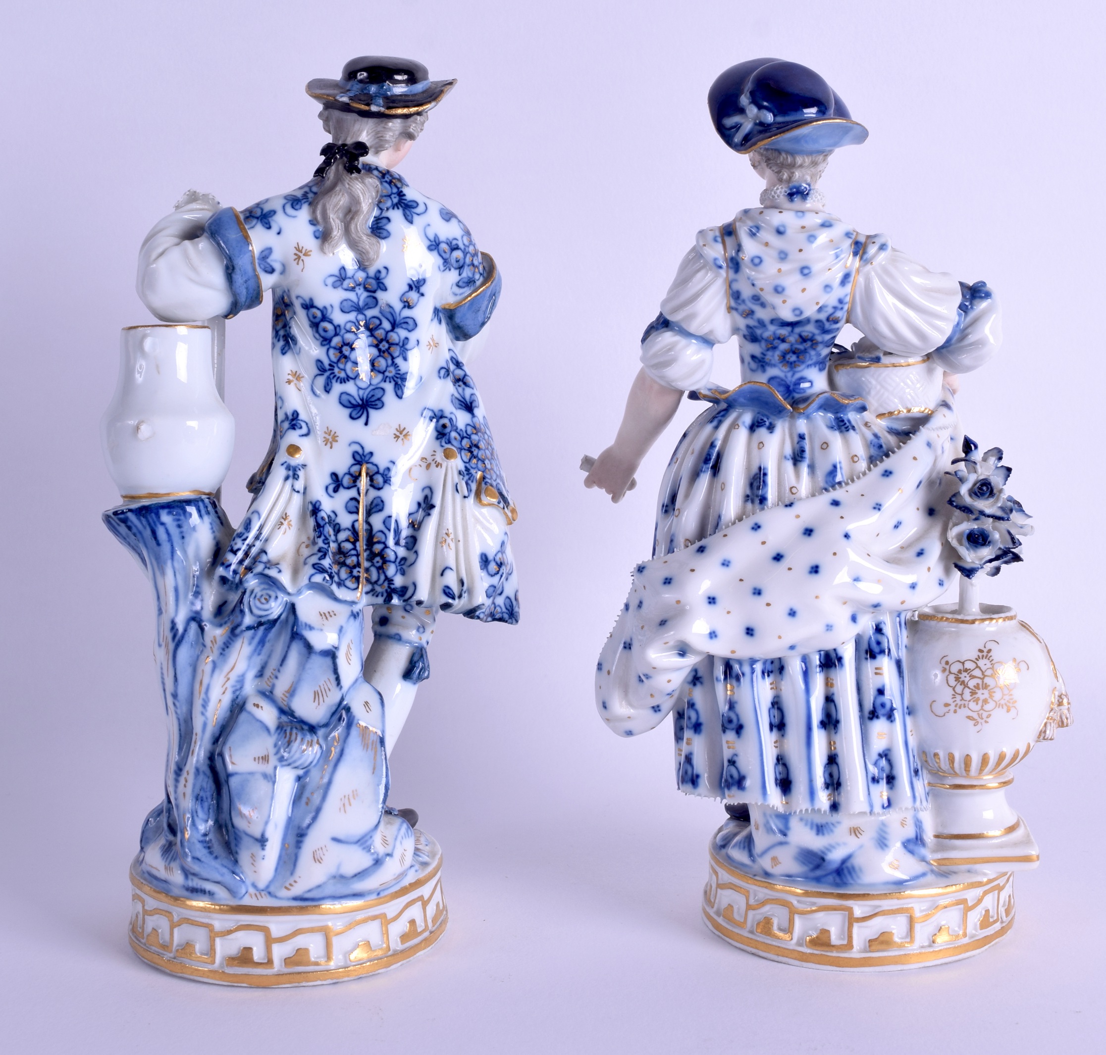 A PAIR OF 19TH CENTURY MEISSEN PORCELAIN FIGURES OF GARDENERS painted with blue flowers. 19 cm - Image 2 of 3