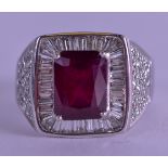 A GOOD 18CT WHITE GOLD AND RUBY DECO STYLE RING. Size W/X.