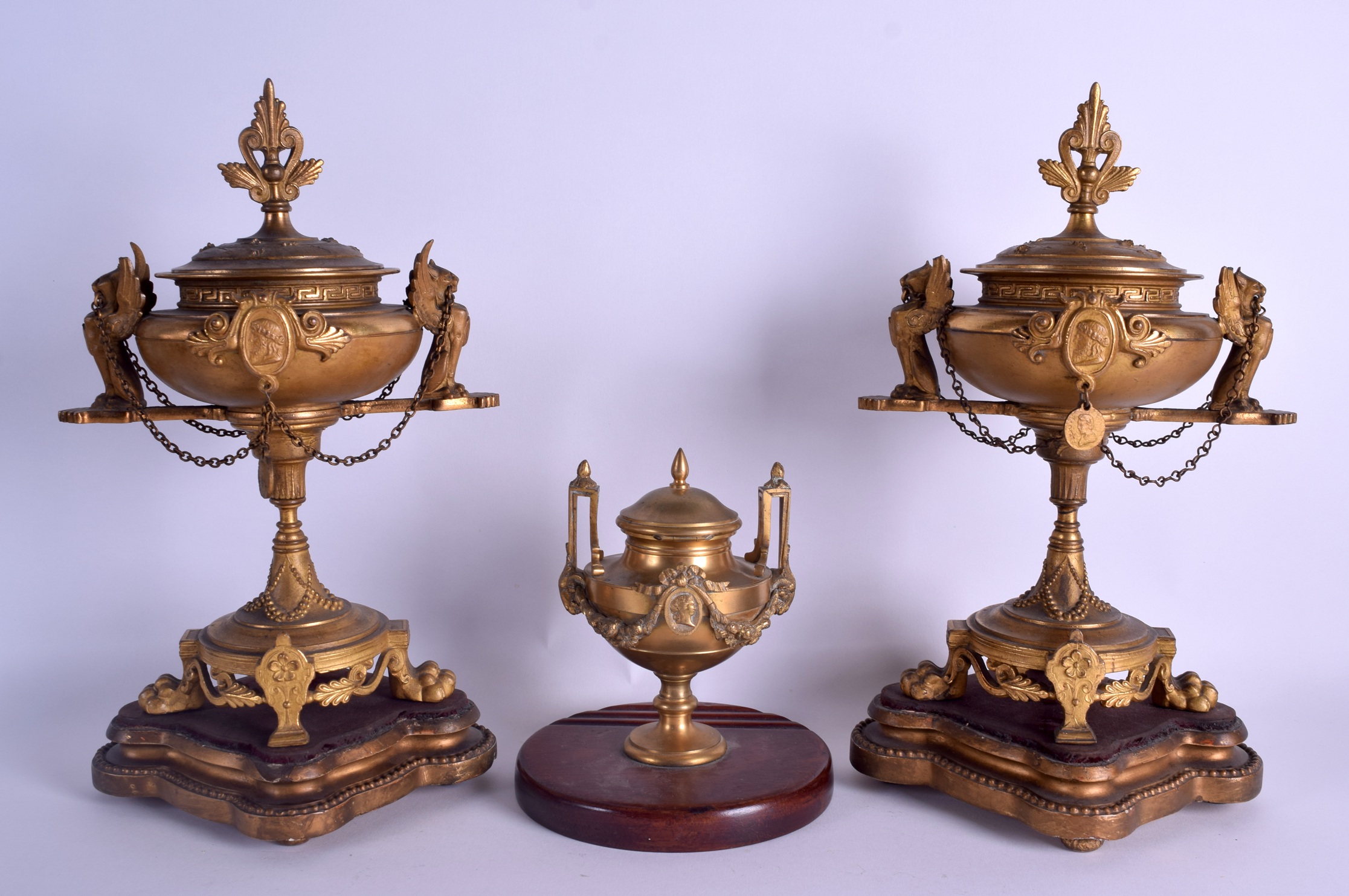 A 19TH CENTURY FRENCH GILT METAL MANTEL GARNITURE formed with two griffin mounts urns & a smaller - Image 2 of 3