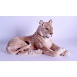 A LARGE ROYAL COPENHAGEN FIGURE OF A RECUMBENT LIONESS. 30 cm long.