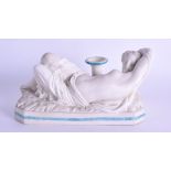 A 19TH CENTURY PARIANWARE FIGURE OF A SLEEPING FEMALE modelled reclining upon an octagonal base.