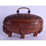 A NEW ZEALAND TRIBAL MAORI FEATHER BOX WAKAHUIA formed as numerous figures supporting an oval box,