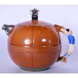 AN UNUSUAL SADLER PORCELAIN TEA POT IN THE FORM OF A FOOTBALL, the finial a trophy and the handle