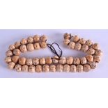 AN UNUSUAL CARVED TRIBAL BONE NECKLACE. 50 cm long.