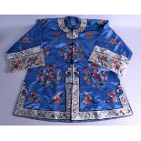 A CHINESE REPUBLICAN PERIOD BLUE SILKWORK JACKET decorated with foliage. 126 cm x 72 cm.