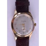 A 9CT GOLD GARRARD WRISTWATCH. 3.25 cm diameter.