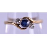 AN ANTIQUE 18CT GOLD DIAMOND AND SAPPHIRE RING. 2.7 grams. Size O.