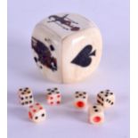 A CARVED AND PAINTED BONE DICE. 3.75 cm x 3.75 cm.