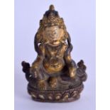 A LATE 19TH CENTURY CHINESE TIBETAN PAINTED BRONZE FIGURE OF A GOD modelled seated upon a lotus