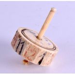 AN 18TH/19TH CENTURY CARVED AND PAINTED BONE SPINNING DICE. 6 cm x 4 cm.