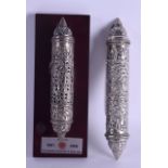 TWO ABU DHABI WHITE METAL SCROLL HOLDERS. 24 cm & 20 cm long. (2)