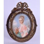 AN EARLY 20TH CENTURY CONTINENTAL PAINTED IVORY PORTRAIT MINIATURE depicting a female wearing pink