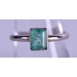 A GOOD PLATINUM AND EMERALD RING. 3.5 grams. Size Q.
