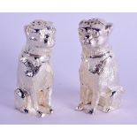 A PAIR OF SILVER PLATED DOG CONDIMENTS. 7 cm high.