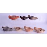 SEVEN EARLY ANTIQUITY TERRACOTTA OIL LAMPS. Largest 11 cm wide. (7)