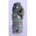 A CHINESE CARVED JADEITE SEAL overlaid with a toad. 5 cm high.