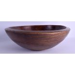 A CONTINENTAL TREEN CARVED WOOD BOWL. 35 cm diameter.