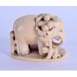 A 19TH CENTURY JAPANESE MEIJI PERIOD CARVED IVORY OKIMONO modelled as numerous children clambering