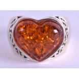 A SILVER AND AMBER HEART RING. Size N.