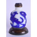 AN UNUSUAL EARLY 20TH CENTURY PEKING GLASS SNUFF BOTTLE AND STOPPER upon a bronze base. Bottle 7.5