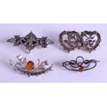 FOUR SILVER BROOCHES. (4)