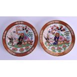 A FINE PAIR OF FLIGHT BARR AND BARR IMARI PLATES painted with a fenced garden, holed rock and a