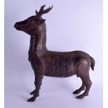 A LARGE CHINESE BRONZE FIGURE OF A STANDING DEER decorated with circular motifs. 37 cm x 42 cm.
