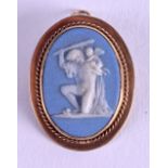 A GOLD WEDGWOOD CAMEO PENDANT. 2 cm x 3 cm.