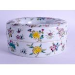 A CHINESE FAMILLE ROSE CIRCULAR BOX AND COVER painted with flowers and insects. 14 cm wide.