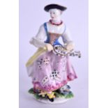 AN 18TH CENTURY BOW FIGURE OF A MUSICIAN modelled playing the hurdy gurdy. 12.5 cm high.