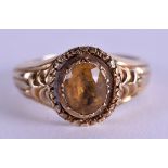 AN EDWARDIAN 9CT GOLD CITRINE RING. Size S.