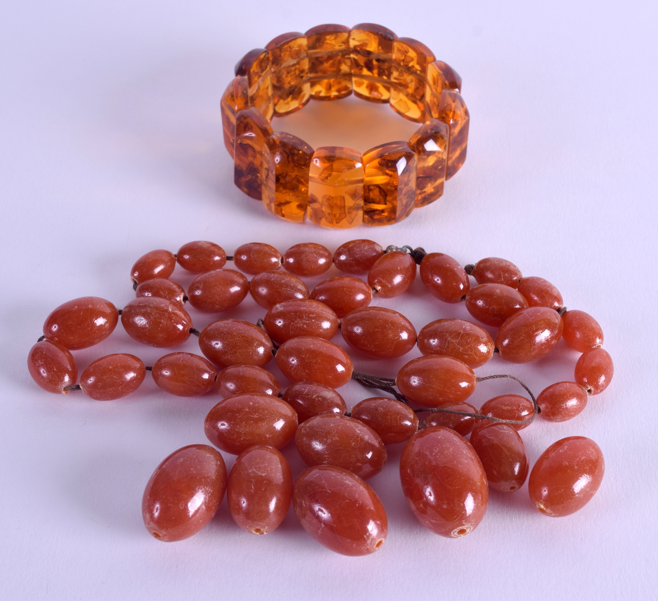 VARIOUS AMBER BEADS together with an amber bracelet. 119 grams. (qty)