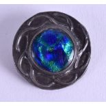 AN ARTS AND CRAFTS SILVER AND ENAMEL CELTIC KNOT BROOCH. 3.75 cm diameter.