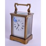 AN EARLY 20TH CENTURY FRENCH BRASS CARRIAGE CLOCK. 18.5 cm high inc handle.