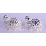 A PAIR OF SILVER PLATED QUAIL CONDIMENTS. 6 cm wide.